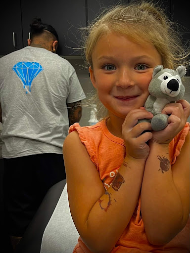 Explore rose tattoo ideas for women, creative tattoo ideas in Lansing, available at Be-You-tiful Body Piercing & Fine Jewelry