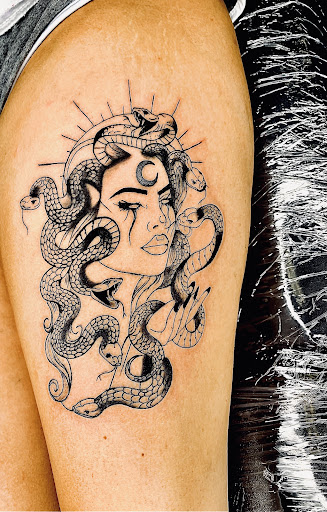 Explore cuff tattoo ideas, creative tattoo ideas in Lake City, available at Crooked Spines Tattoo Studio