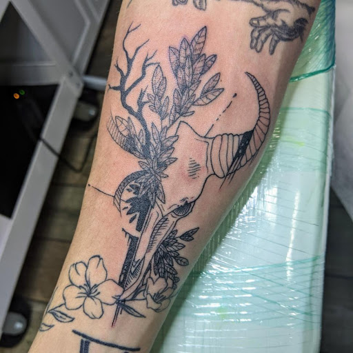 Explore chain link tattoo ideas, creative tattoo ideas in Buford, available at Wild Tribe Tattoos and Piercings