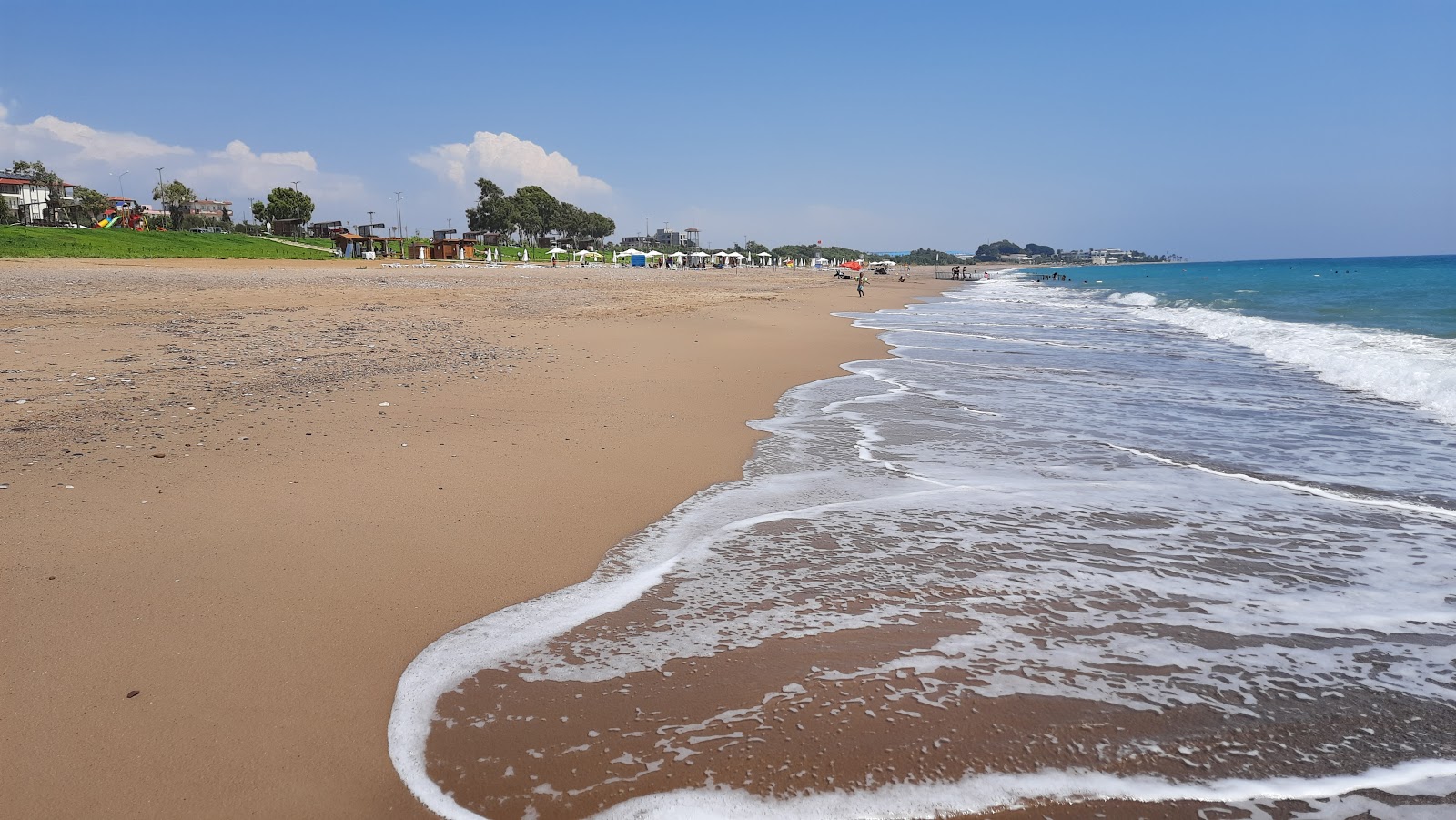 Zdjęcie Kizilot Public beach z powierzchnią brązowy piasek