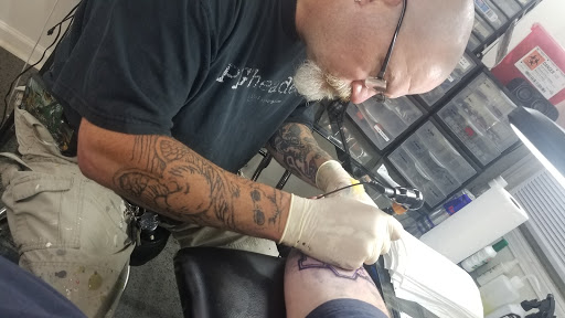 Explore back neck tattoo ideas, creative tattoo ideas in Abbeville, available at Permanent Decisions