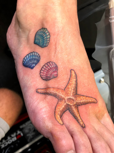 Explore violin tattoo ideas, creative tattoo ideas in Englewood, available at Point of Entry Tattoo