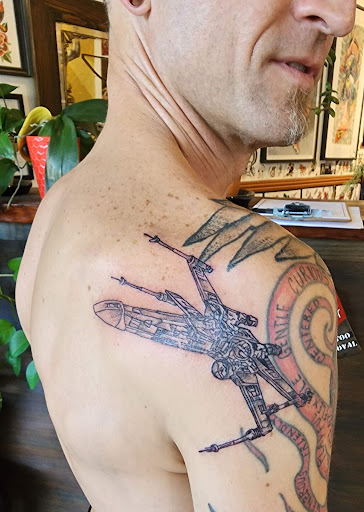 Explore male thigh tattoo ideas, creative tattoo ideas in Fairfax, available at The Forge Tattoo