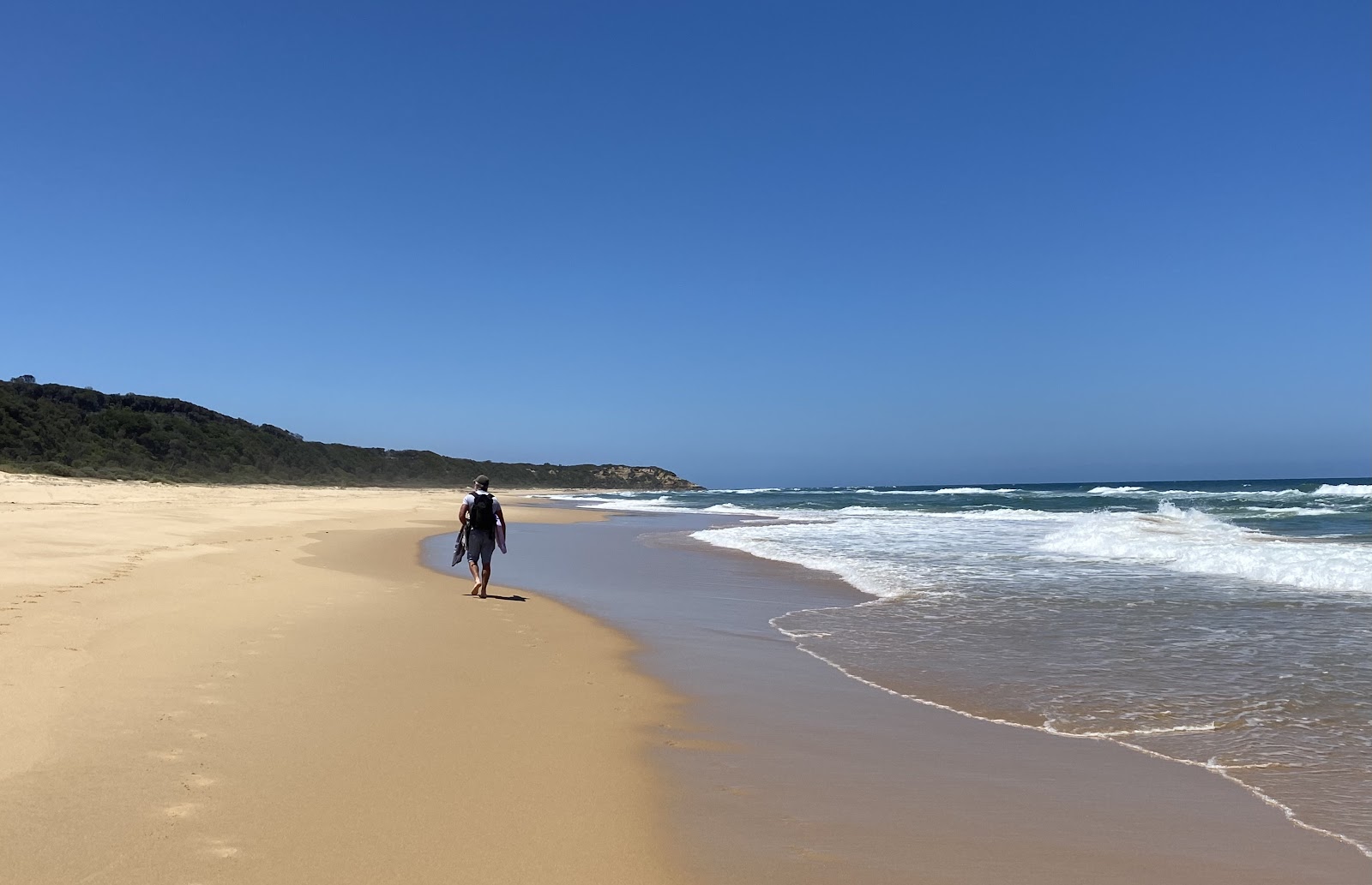 Foto di Shelly Beach con una superficie del sabbia beige fine
