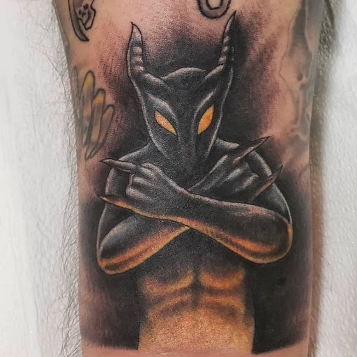 Explore mens upper back tattoo ideas, creative tattoo ideas in Wappingers Falls, available at Graceland Tattoo