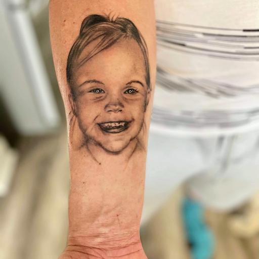 Explore cover up tattoo ideas lower back, creative tattoo ideas in Roscoe, available at Elevated Ink Tattoo