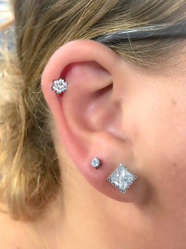 Explore pretty flower tattoo ideas, creative tattoo ideas in Springfield, available at Body Piercing By Qui Qui