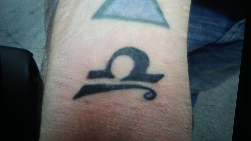 Find biohazard tattoo ideas for your next unique tattoo in Lima at White Wizard Tattoo & Body Piercing