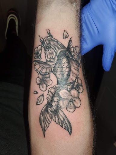 Explore initial finger tattoo ideas, creative tattoo ideas in Palm Harbor, available at Angry Owl Tattoo and Piercing