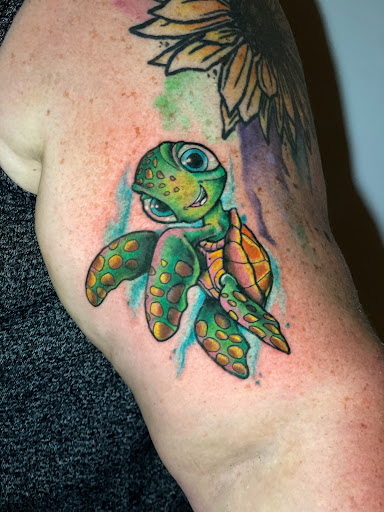 Explore girl sleeve tattoo ideas, creative tattoo ideas in Kansas City, available at Golden Stag Tattoo and Gallery