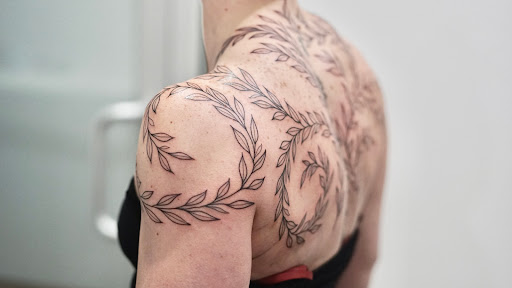 Find male tattoo ideas shoulder for your next unique tattoo in Saint Johns at Flamingo Ink