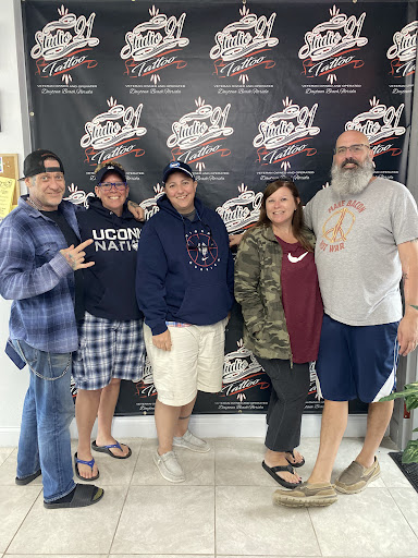 Explore fist tattoo ideas, creative tattoo ideas in Daytona Beach, available at Studio 21 Tattoo & Piercings Daytona Beach