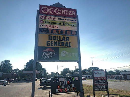 Explore cover up tattoo ideas black, creative tattoo ideas in Osceola, available at Crowned Raven Tattoo Inc.