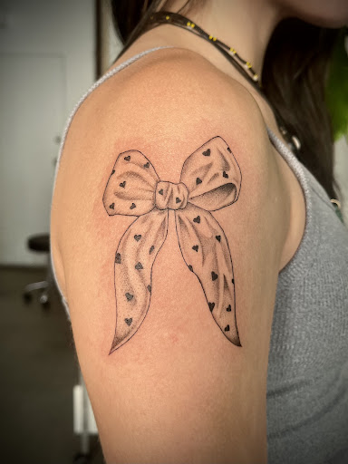 Explore garter tattoo ideas, creative tattoo ideas in Las Vegas, available at Black Sacrament Tattoo