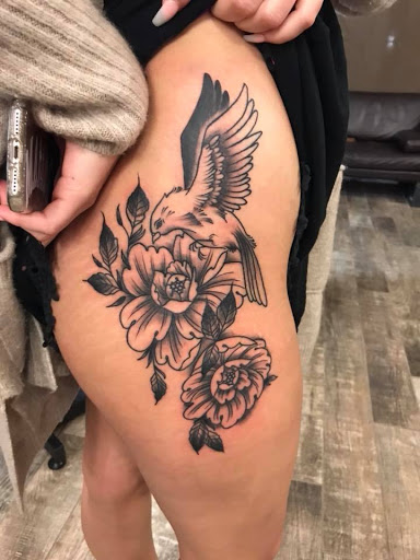 Explore hand tattoo ideas for guys, creative tattoo ideas in Lakeland, available at Black Swan Tattoo