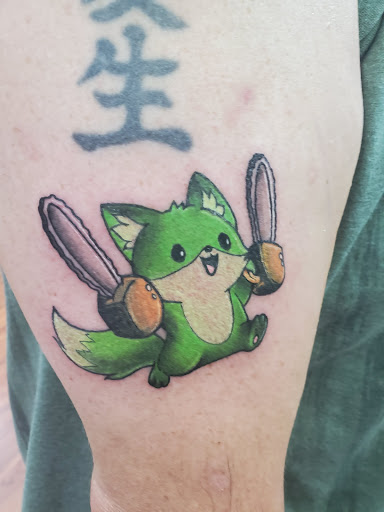 Explore bike tattoo ideas, creative tattoo ideas in Cocoa, available at Rorschach Tattoo Shop and Piercing Studio