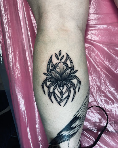 Explore tattoo flower sleeve ideas, creative tattoo ideas in Lake City, available at Crooked Spines Tattoo Studio