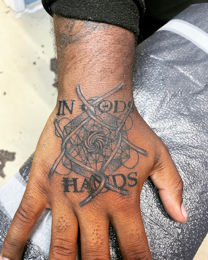 Explore hand tattoo ideas for man, creative tattoo ideas in Mount Holly, available at Permanent Vacation Tattoos