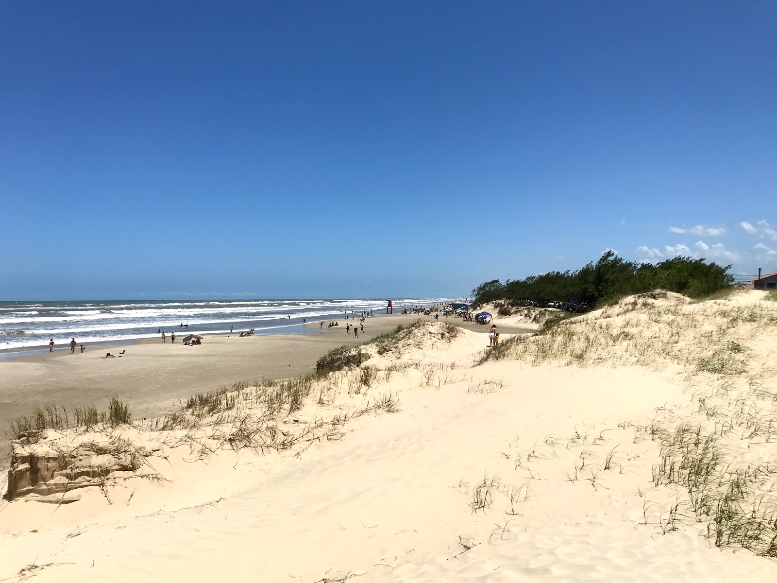 Photo of Santa Teresinha Beach with bright fine sand surface