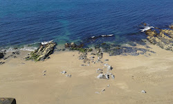 Photo de Plage de Porthleven entouré de montagnes