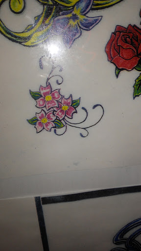 Explore tattoo ideas for the back of the neck, creative tattoo ideas in Durham, available at Tattoo Asylum