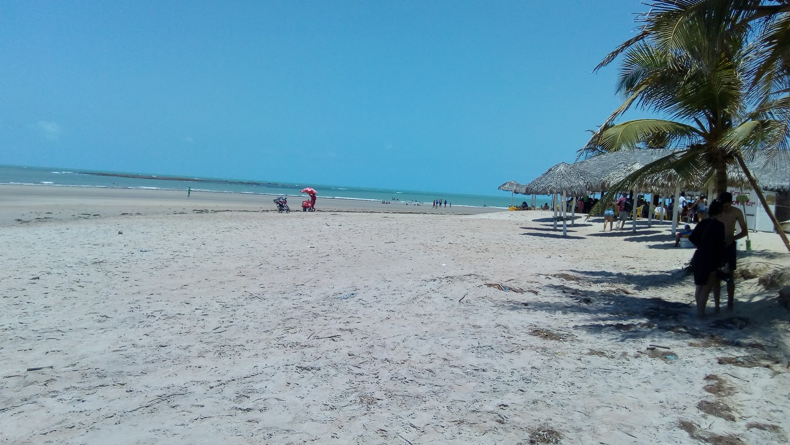 Foto von Praia de Coqueiro mit langer gerader strand