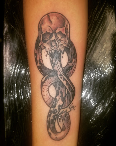 Explore middle neck tattoo ideas, creative tattoo ideas in Chicago, available at Lucky Devil Tattoo and Piercings