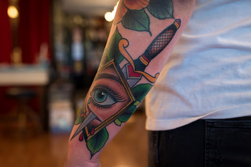 Explore men's inner bicep tattoo ideas, creative tattoo ideas in Santa Rosa, available at Monkey Wrench Tattoo