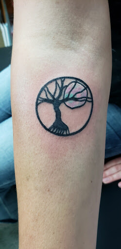 Explore mens upper back tattoo ideas, creative tattoo ideas in Springfield, available at Area 51 Tattoo