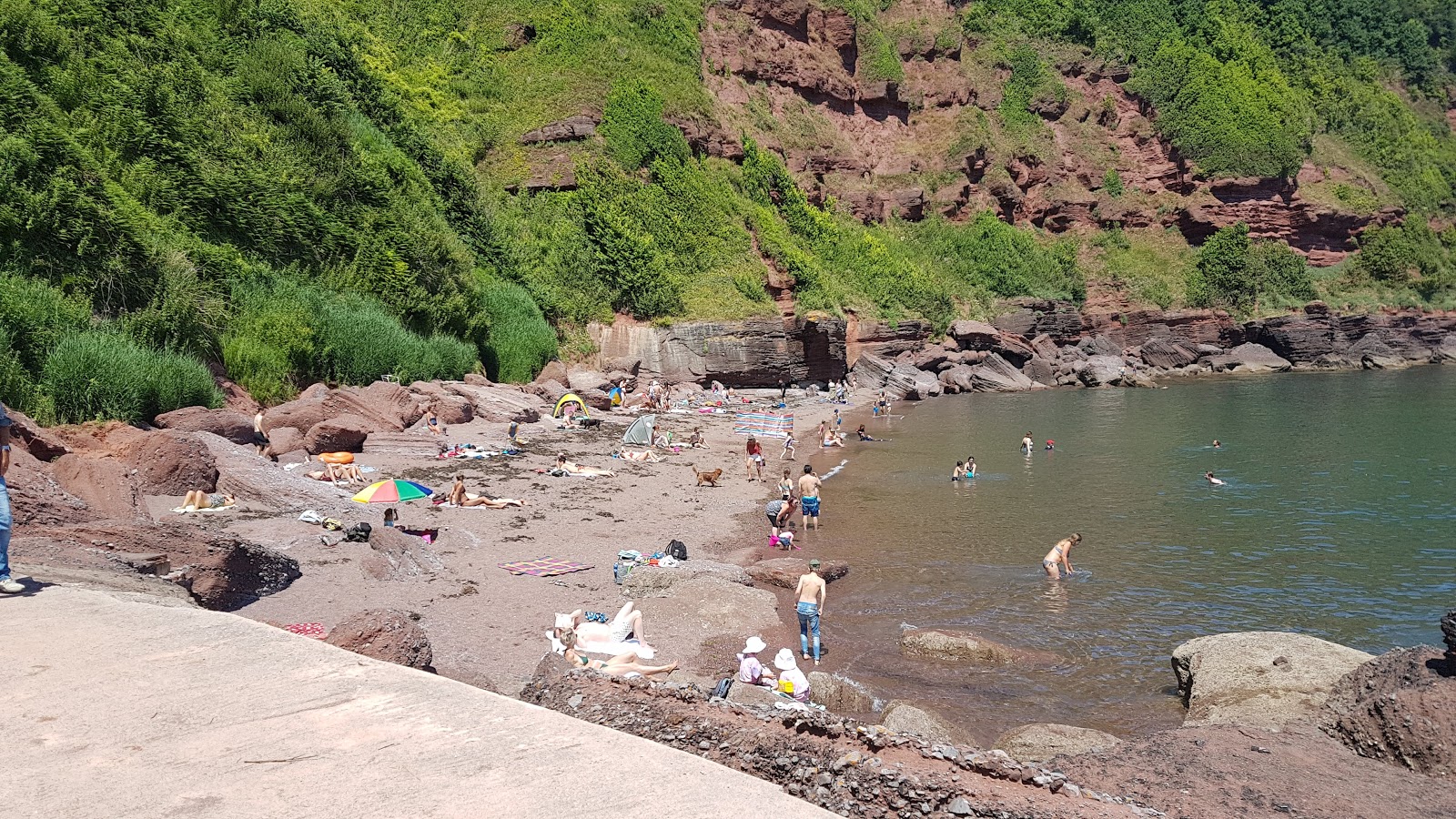 Photo of Maidencombe beach with turquoise pure water surface