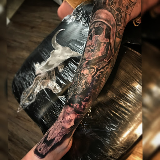 Explore book dragon tattoo ideas, creative tattoo ideas in Murrieta, available at CON INK TATTOOS LLC