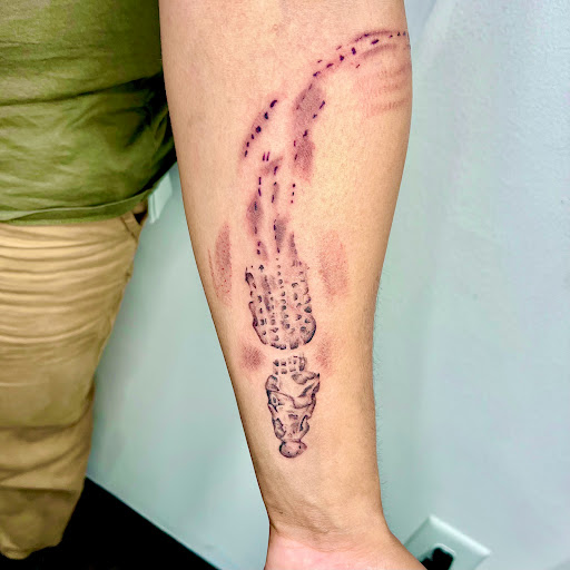 Explore tattoo ideas on ribs for men, creative tattoo ideas in Wilmington, available at Rogue Tattoo Studio