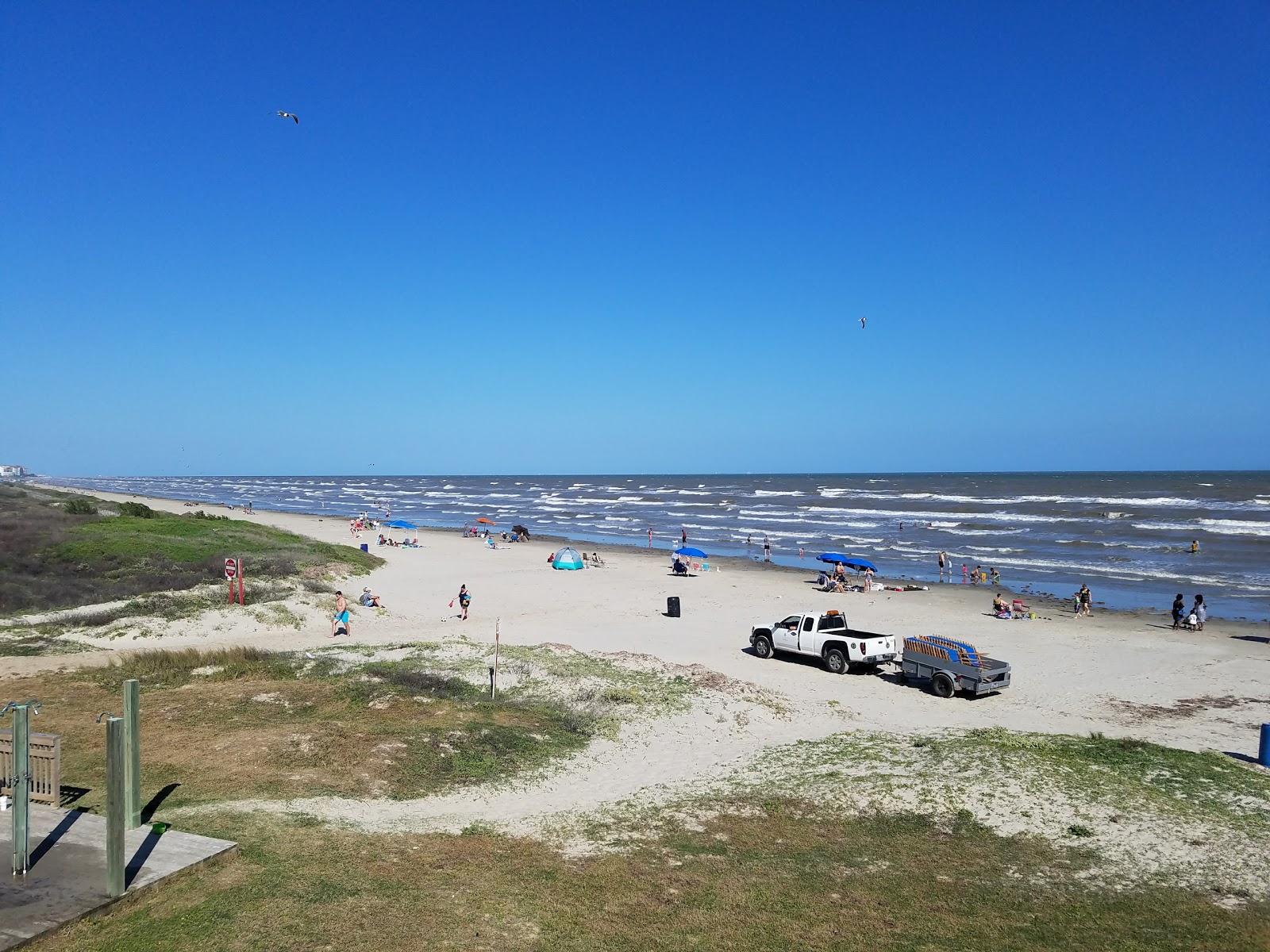 Photo of Galveston beach II with gray sand surface