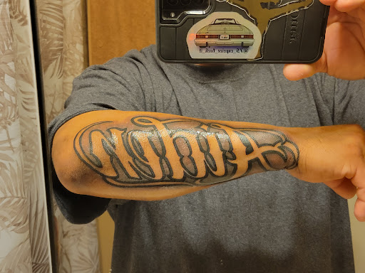 Explore female throat tattoo ideas, creative tattoo ideas in Arcadia, available at Rubes Tattoos