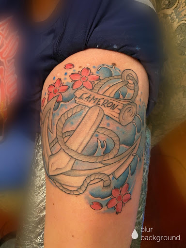 Explore african american tattoo ideas, creative tattoo ideas in Eden, available at Slicks Tattoo Studio