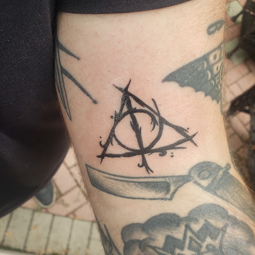 Explore time flies tattoo ideas, creative tattoo ideas in Zephyrhills, available at MAIN STREET INK TATTOOS