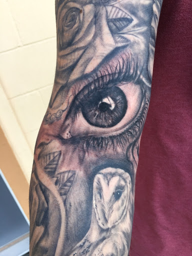 Explore blackout tattoo ideas, creative tattoo ideas in Lawton, available at Avenue Tattoo Studio