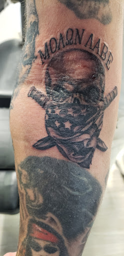 Explore superman tattoo ideas, creative tattoo ideas in Toledo, available at Artistik Tat2 and Body Piercing