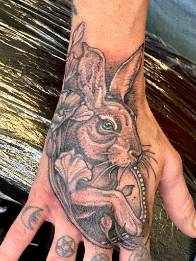 Explore feather memorial tattoo ideas, creative tattoo ideas in Selbyville, available at Skin Deep Studios