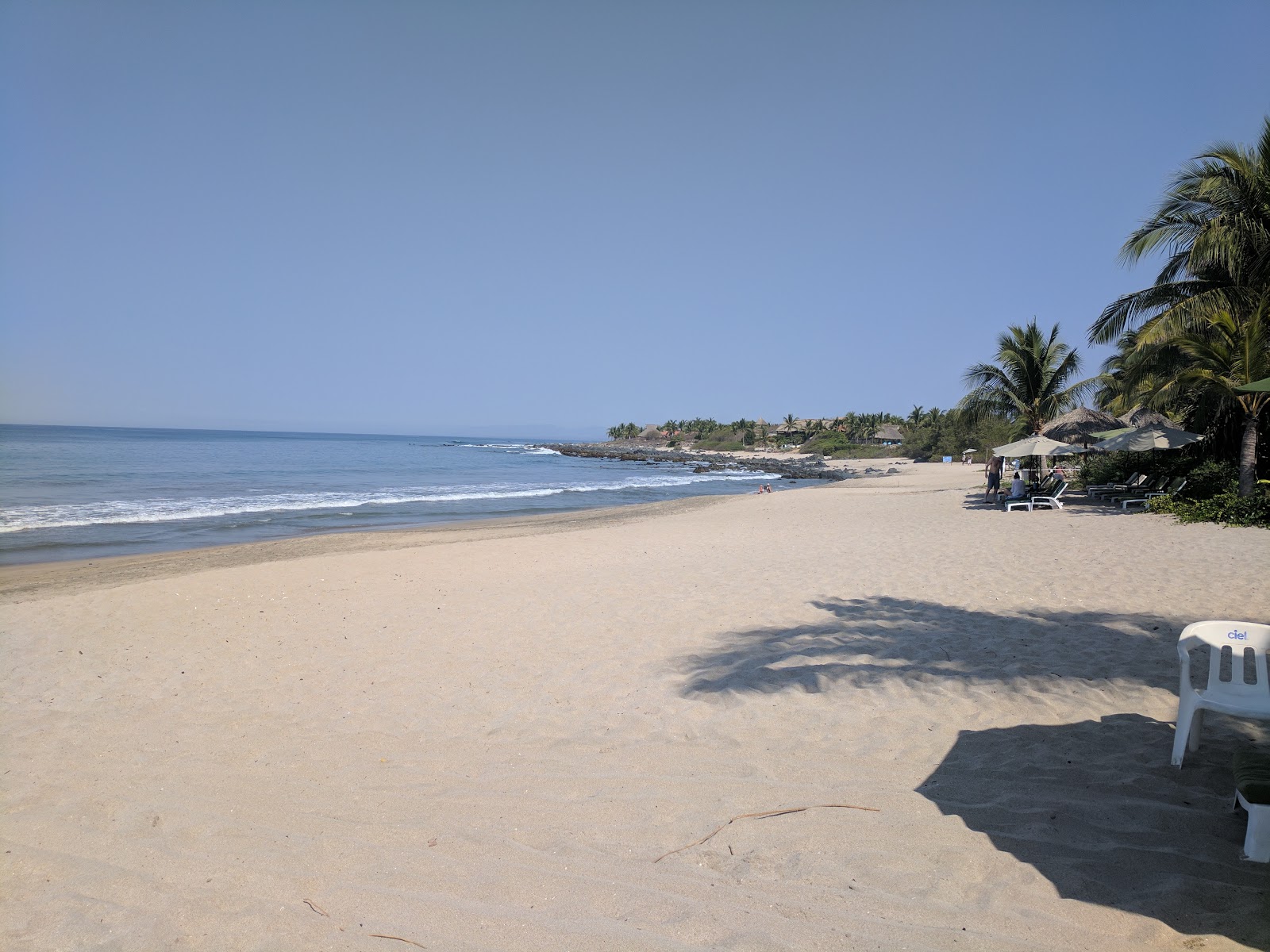 Photo de Playa Manzanillo avec sable lumineux de surface