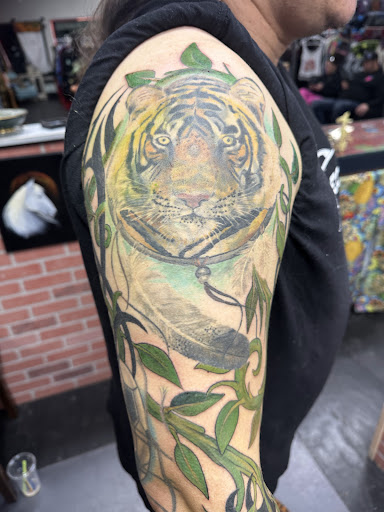 Explore men's fine line tattoo ideas, creative tattoo ideas in Lincoln City, available at Black N Blue Tattoo & Skate Shop