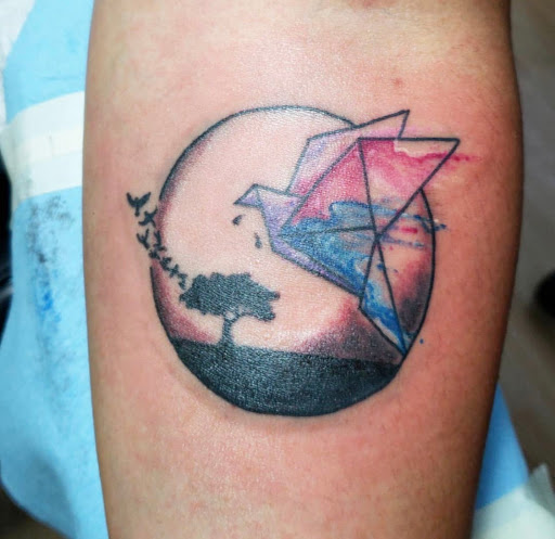 Explore ouroboros tattoo ideas, creative tattoo ideas in Kenosha, available at Kenosha Tattoo Company