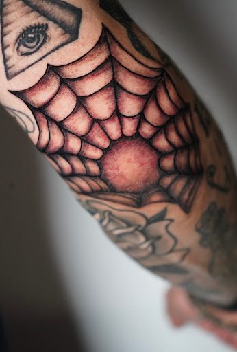 Explore bite me tattoo ideas, creative tattoo ideas in New York, available at Red Baron Ink Tattoo and Piercing