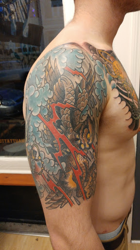 Explore small raven tattoo ideas, creative tattoo ideas in Covington, available at Illuminaut Tattoo