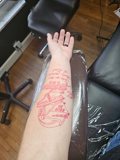 Explore cupid tattoo ideas, creative tattoo ideas in Dayton, available at Cloak and Dagger Tattoo Studio