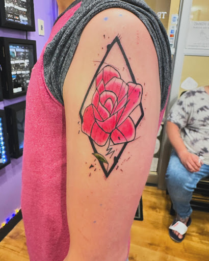 Explore men's behind the ear tattoo ideas, creative tattoo ideas in Aurora, available at Tranquil Soul Ink (located inside Sola Salon Studios)