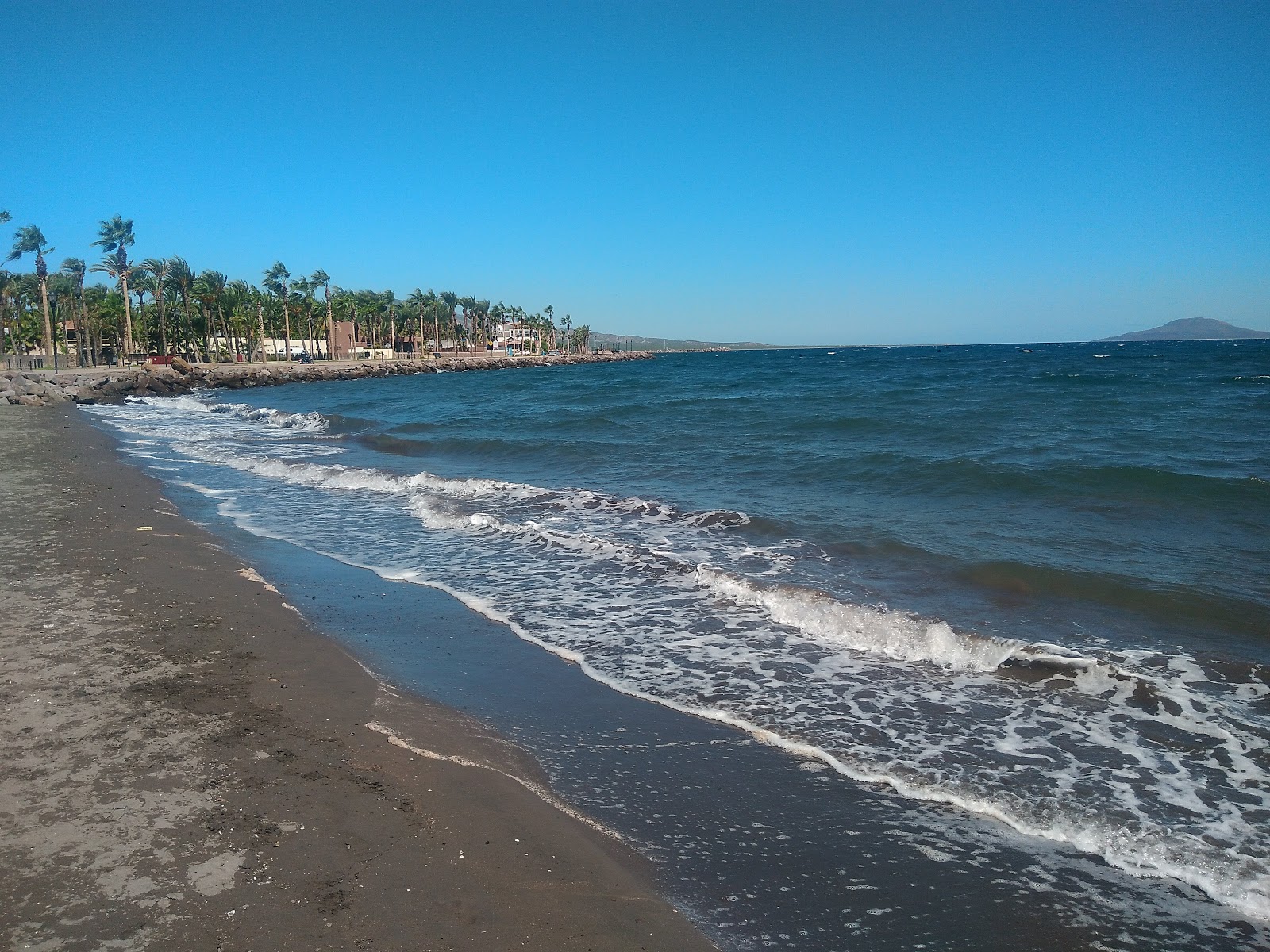 Photo de Playa Oasis avec l'eau bleu de surface