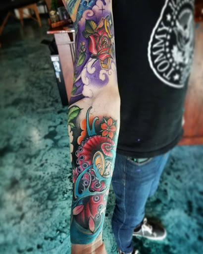 Explore small floral tattoo ideas, creative tattoo ideas in Charlotte, available at Tattoo Me Charlotte