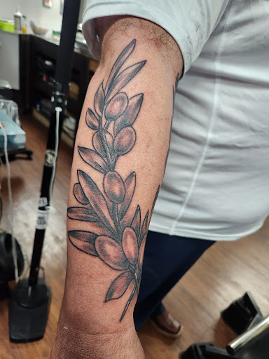 Explore bottom sleeve tattoo ideas, creative tattoo ideas in Rogers, available at Saved by Grace Tattoo Studio