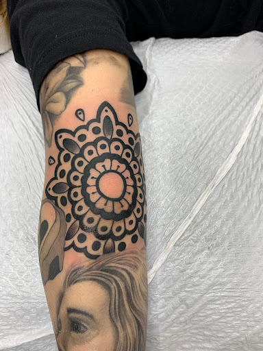 Find guardian tattoo ideas for your next unique tattoo in Cranston at TomButts Tattoo LLC